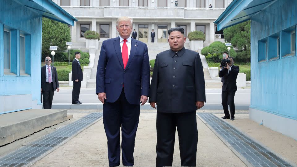 Then-President Trump and North Korean leader Kim Jong Un pose at a military demarcation line separating the two Koreas in Panmunjom, South Korea, on June 30, 2019. - KCNA/Reuters