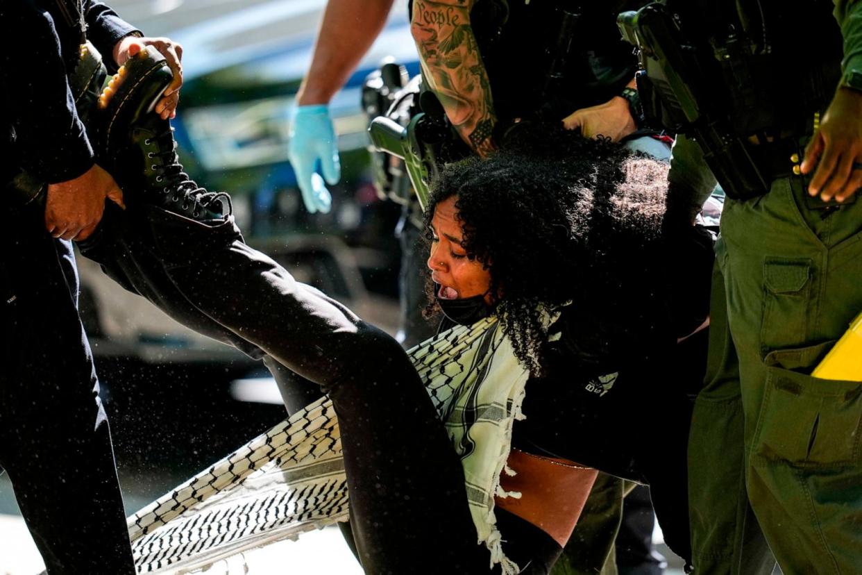 PHOTO: Authorities detain a protester on the campus of Emory University during a pro-Palestinian demonstration, April 25, 2024, in Atlanta.  (Mike Stewart/AP)