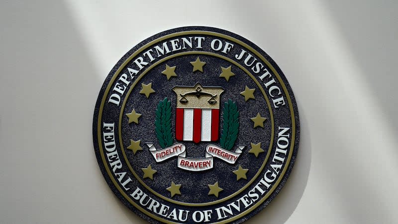 An FBI seal is seen on a wall on Aug. 10, 2022, in Omaha, Neb. Section 702 of the Foreign Intelligence Surveillance Act will sunset on April 19 unless reauthorized.