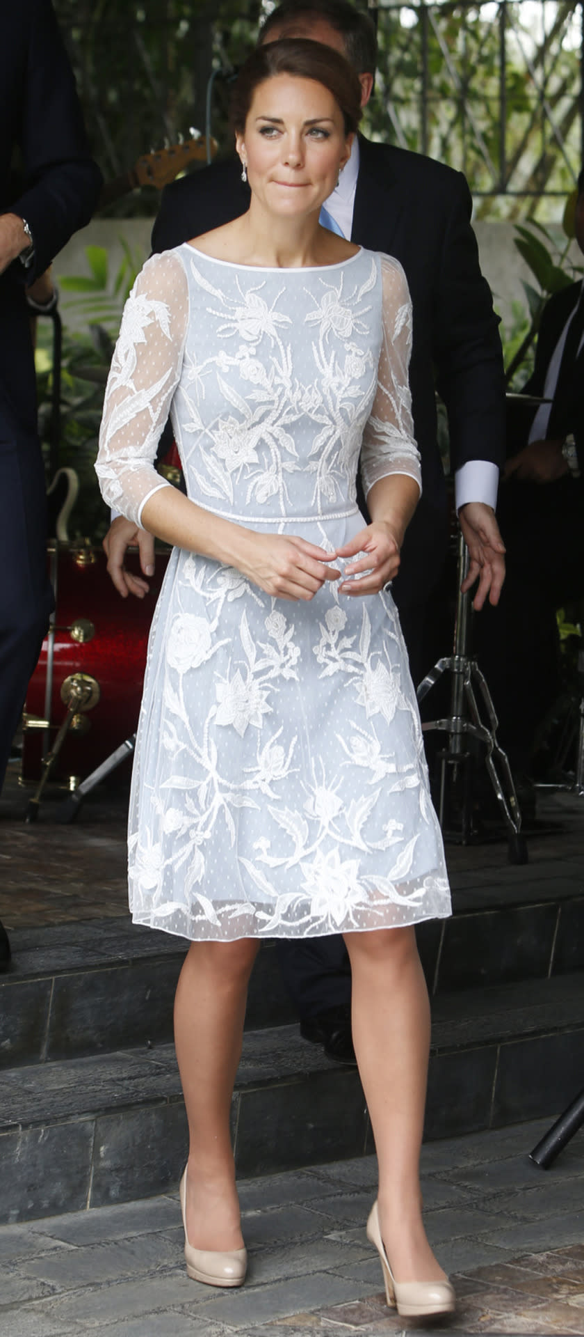 <p>Kate attended a tea party in Kuala Lumpur in an ice blue Temperley dress. Featuring elegant white embroidery, she wore nude L.K. Bennett heels. </p><p><i>[Photo: PA]</i></p>