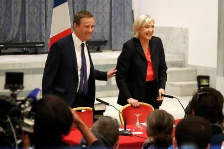 Marine Le Pen French National Front (FN) political party leader and candidate for French 2017 presidential election and Debout La France group former candidate Nicolas Dupont-Aignan attend a news conference in Paris, France, April 29, 2017. REUTERS/Charles Platiau
