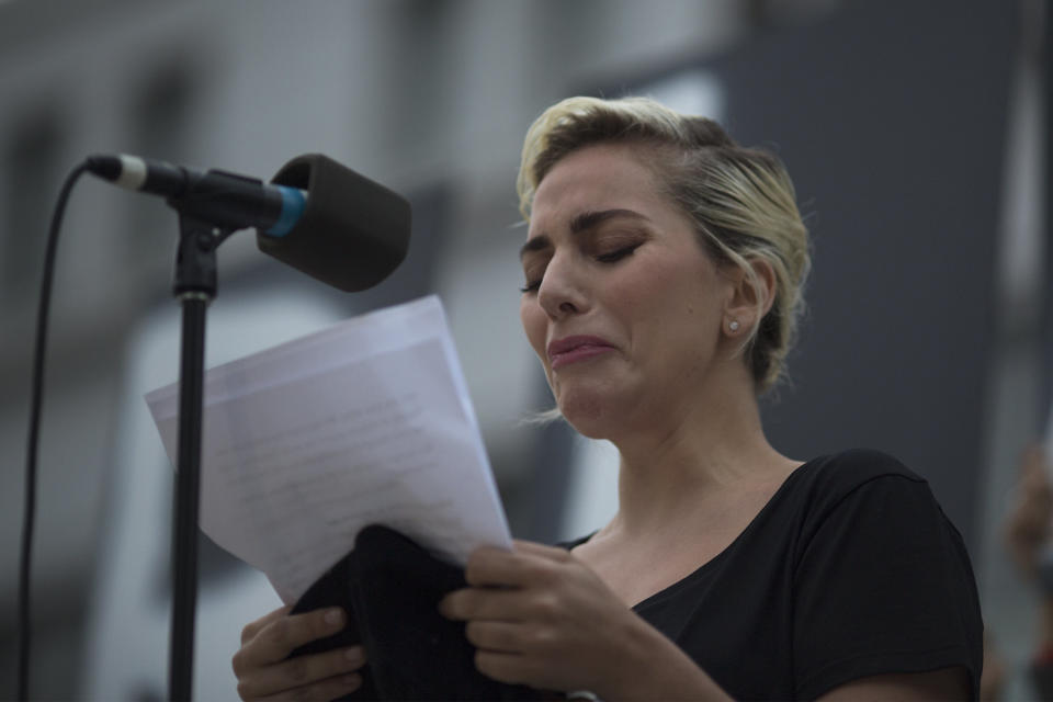 LOS ANGELES, CA - JUNE 13: Singer Lady Gaga tries not to cry while reading some of the names of the dead at a vigil for the worst mass shooing in United States history on June 13, 2016 in Los Angeles, United States. A gunman killed 49 people and wounded 53 others at a gay nightclub in Orlando, Florida early yesterday morning before suspect Omar Mateen also died on-scene.  (Photo by David McNew/Getty Images)