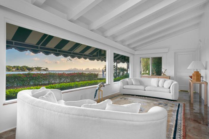 a white room with large windows in the most expensive home currently for sale in Florida, 18 La Gorce Circle in Miami Beach