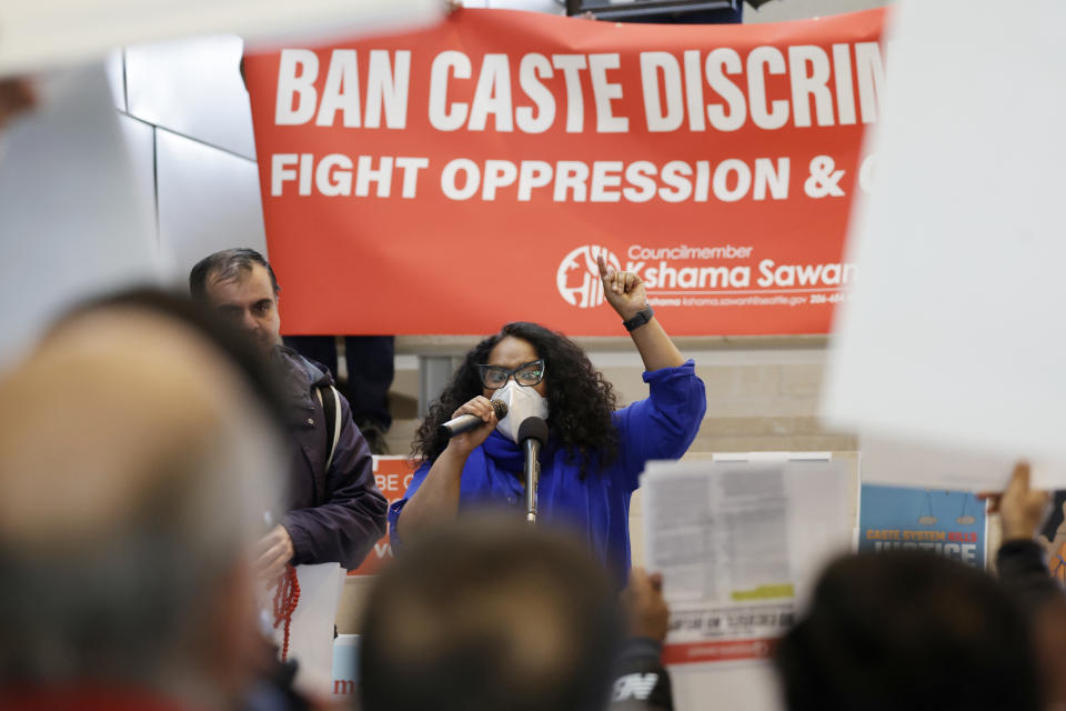 Thenmozhi Soundararajan, founder and executive director of Equality Labs, speaks to supporters and opponents a of a proposed ordinance to add caste to Seattle’s anti-discrimination laws rally at Seattle City Hall, Tuesday, Feb. 21, 2023, in Seattle. Council Member Kshama Sawant proposed the ordinance. (AP Photo/John Froschauer)