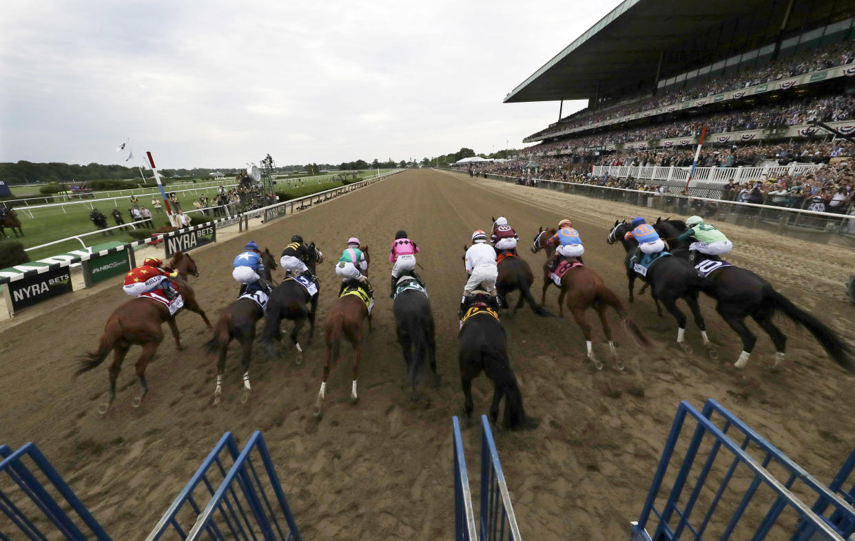 After a slow start, Restoring Hope (middle in pink) veered to his left toward the front. (AP)