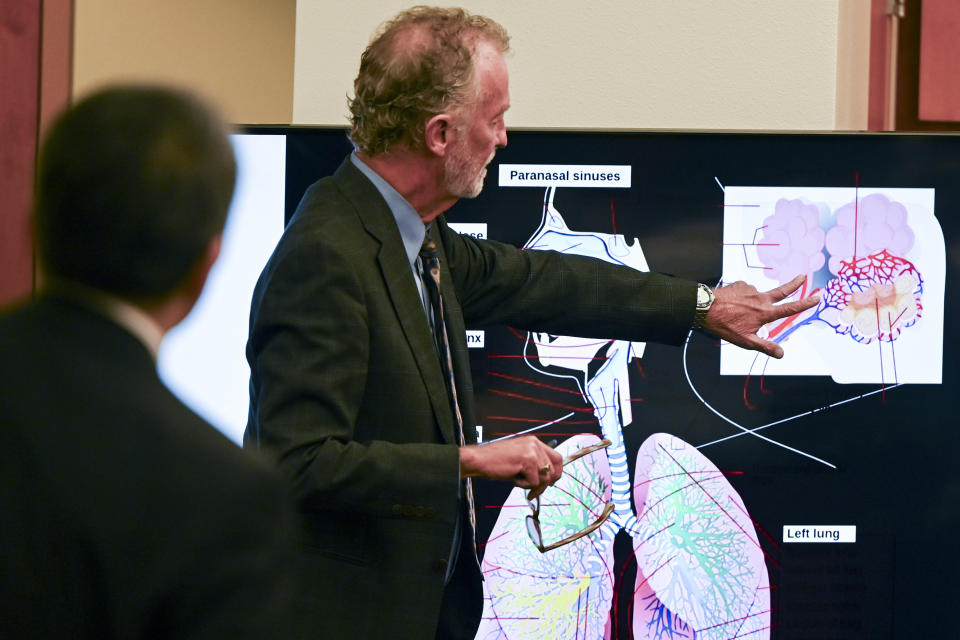 Outside of the presence of the jury, Dr. Curtis Veal, the state’s pulmonology expert, explains the breathing functions to the state, court and defense during the trial of three Tacoma Police officers in the death of Manny Ellis at Pierce County Superior Court, Tuesday, Oct. 31, 2023, in Tacoma, Wash. Tacoma Police Officers Christopher Burbank, Matthew Collins and Timothy Rankine stand trial for charges related to the March 2020 killing of Manny Ellis. (Brian Hayes/The News Tribune via AP, Pool)