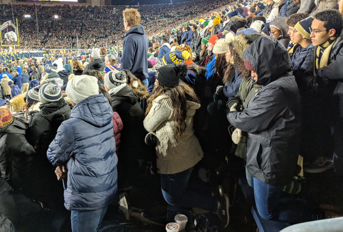 A group of Notre Dame students kneel during the playing of the national anthem prior to Saturday’s game in South Bend. (Courtesy of <a href="https://ndsmcobserver.com/2018/11/students-kneel-during-national-anthem/" rel="nofollow noopener" target="_blank" data-ylk="slk:Andrew Cameron/The Observer;elm:context_link;itc:0;sec:content-canvas" class="link ">Andrew Cameron/The Observer</a>)