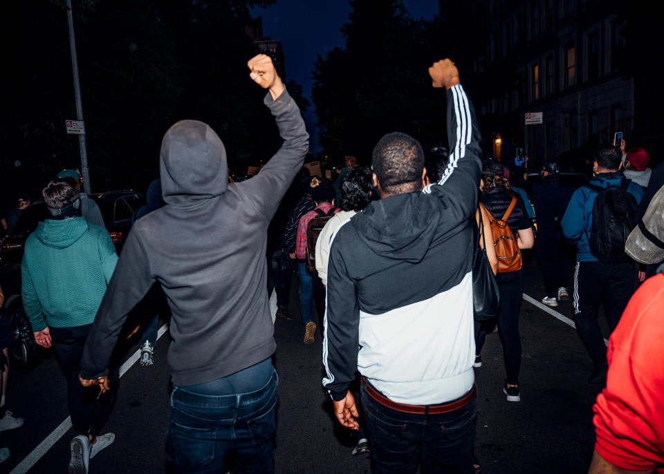 Two men walk during a peaceful demonstration on the west side of Manhattan on May 31. | Malike Sidibe for TIME