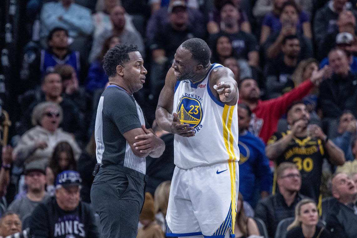 Golden State Warriors forward Draymond Green (23) complains to official Mitchell Irvin during an NBA in-season tournament game at Golden 1 Center on Tuesday, Nov. 28, 2023.