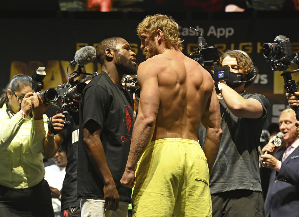 HOLLYWOOD FL - JUNE 05: Floyd Mayweather Jr. weighing in at 155 lbs and Logan Paul weighing in at 189.5 lbs as they face off during the weigh in at Hard Rock Live held at the Seminole Hard Rock and Casino for there exhibition fight on June 6th at Hard Rock Stadium on June 5, 2021 in Hollywood, Florida.Credit: mpi04/MediaPunch /IPX