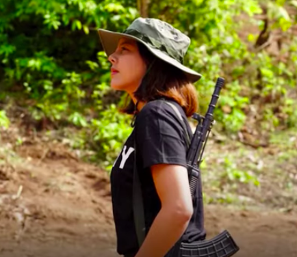 <p>The 32-year-old former beauty queen, Htar Htet Htet, says she is undergoing arms training in a jungle and is prepared to give up everything</p> (Yonhap News/Screengrab)