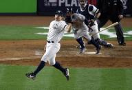 Oct 16, 2017; Bronx, NY, USA; New York Yankees relief pitcher Tommy Kahnle (48) reaches for a ball during the ninth inning against the Houston Astros during game three of the 2017 ALCS playoff baseball series at Yankee Stadium. Mandatory Credit: Adam Hunger-USA TODAY Sports