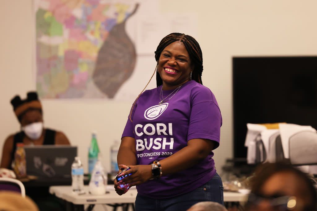 us rep cori bush d mo smiles as she listens to speakers at campaign headquarters