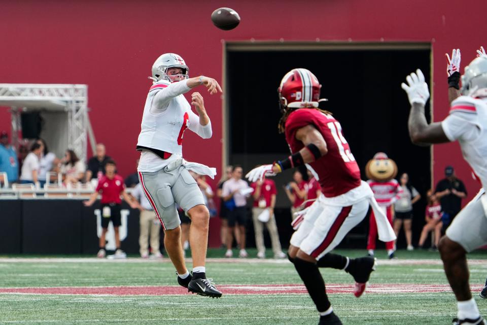 Sep 2, 2023; Bloomington, Indiana, USA; Ohio State Buckeyes quarterback Kyle McCord (6) throws an off-balanced pass that would be intercepted during the first half of the NCAA football game at Indiana University Memorial Stadium.