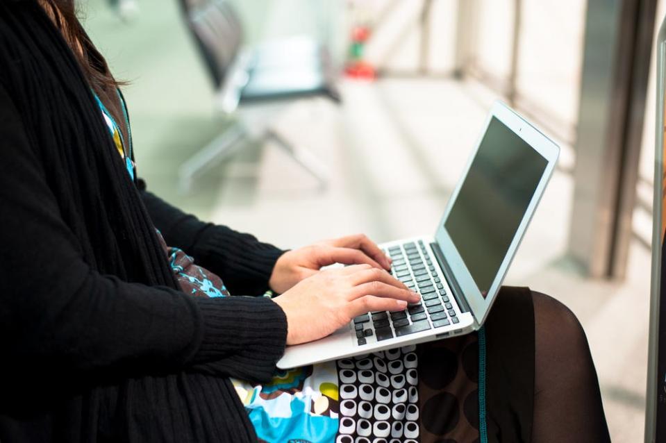 woman typing computer laptop