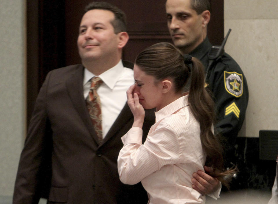 Defense attorney Jose Baez and Casey Anthony, hug after the jury acquitted her of murdering her daughter, Caylee, during Anthony's murder trial at the Orange County Courthouse in Orlando, Fla., Tuesday, July 5, 2011. (AP Photo/Red Huber, Pool)