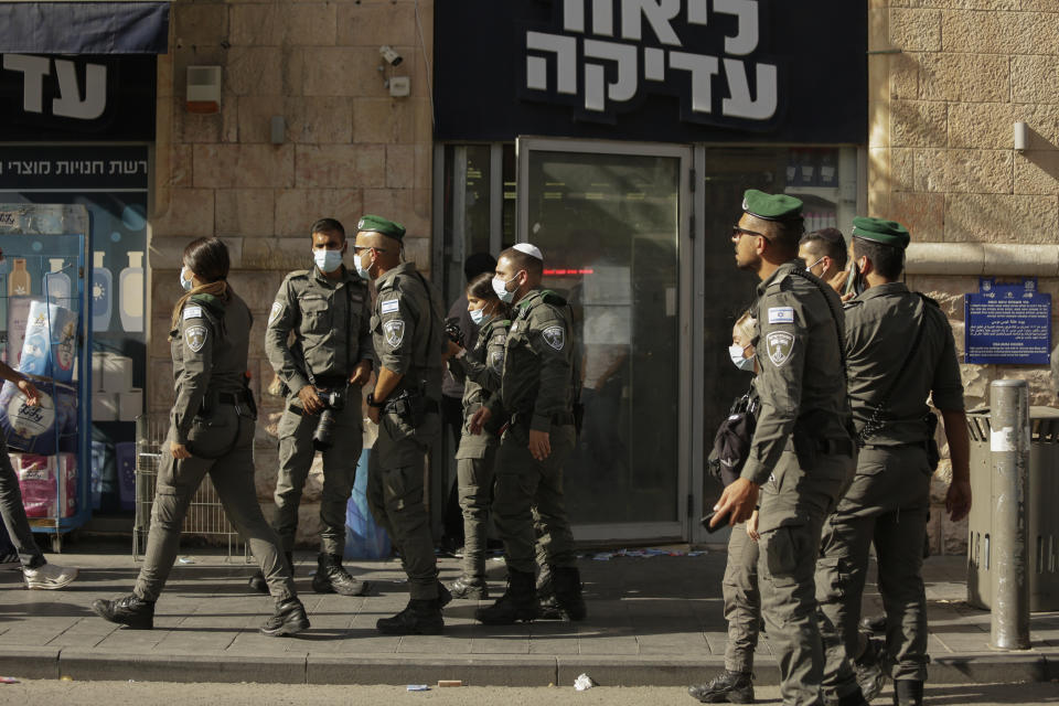 Israeli police inspect the scene of stabbing attack in Jerusalem's Central Bus Station Monday, Sept. 13, 2021. Israeli paramedics treated two people who were stabbed near Jerusalem's Central Bus Station by a suspected Palestinian assailant on Monday. (AP Photo/Maya Alleruzzo)