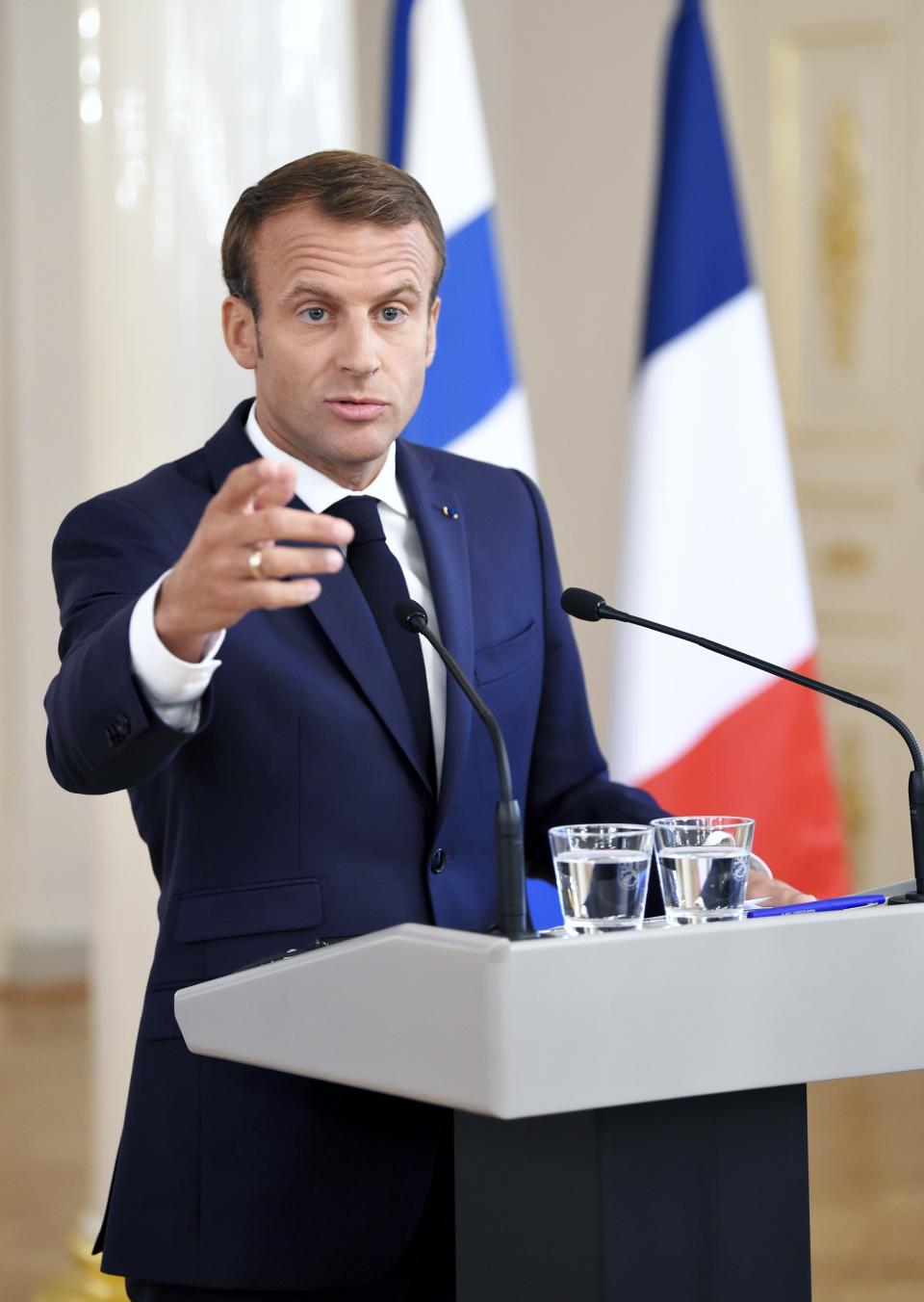 French President Emmanuel Macron attends a joint press conference with Finland President Sauli Niinisto at Presidential Palace in Helsinki, Finland, Thursday Aug. 30, 2018. President Macron is in Finland on a two-day official visit. (Antti Aimo-Koivisto/Lehtikuva via AP)