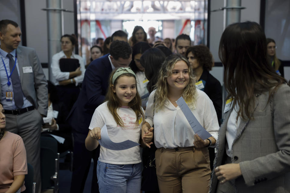 Mariana, left,and Claudia Agostinho arrive at the European Court of Human Rights, where they are accusing 32 European governments of violating their human rights for what they say is a failure to adequately address climate change, Wednesday, Sept. 27, 2023, in Strasbourg. (AP Photo/Jean-Francois Badias)