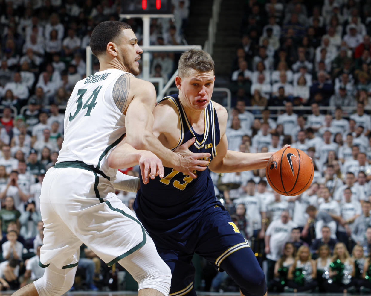 Michigan’s Mortiz Wagner, right, drives against Michigan State’s Gavin Schilling during the first half of an NCAA college basketball game, Saturday, Jan. 13, 2018, in East Lansing, Mich. Michigan won 82-72. (AP)