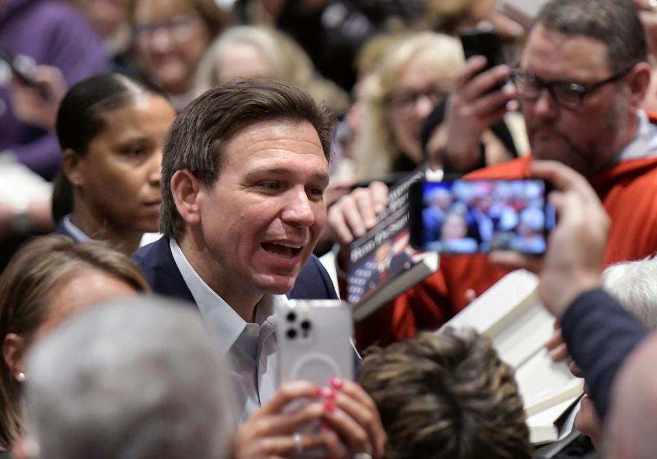 Florida Gov. Ron DeSantis greets supporters on March 10, 2023, in Davenport, Iowa.