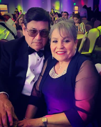 <p>Suzette Quintanilla Instagram </p> Selena Quintanilla's parents Abraham and Marcella Quintanilla at an event.