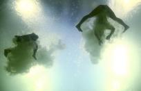 2016 Rio Olympics - Diving - Final - Women's Synchronised 10m Platform - Maria Lenk Aquatics Centre - Rio de Janeiro, Brazil - 09/08/2016. Cheong Jun Hoong (MAS) of Malaysia and Pandelela Rinong (MAS) of Malaysia compete. REUTERS/Michael Dalder FOR EDITORIAL USE ONLY. NOT FOR SALE FOR MARKETING OR ADVERTISING CAMPAIGNS.