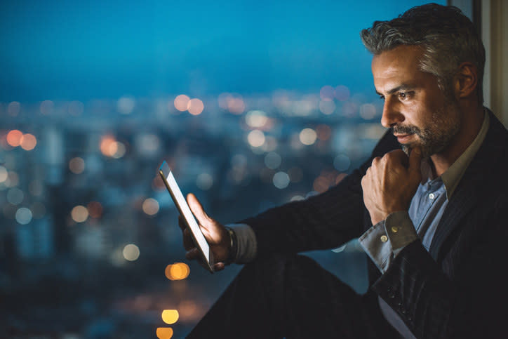 A man using an iPad