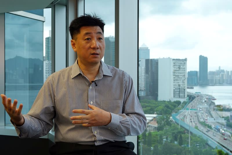 Bao Pu, founder of New Century Press, speaks during an interview with Reuters at his office in Hong Kong