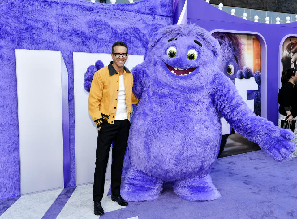 Ryan Reynolds poses with the character "Blue" at the premiere of Paramount Pictures' "IF" at the SVA Theatre on Monday, May 13, 2024, in New York. (Photo by Evan Agostini/Invision/AP)