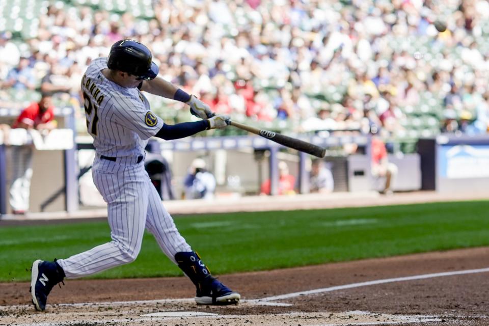 Milwaukee Brewers' Mark Canha hits a home run during the third inning of a baseball game against the Philadelphia Phillies Sunday, Sept. 3, 2023, in Milwaukee. (AP Photo/Morry Gash)