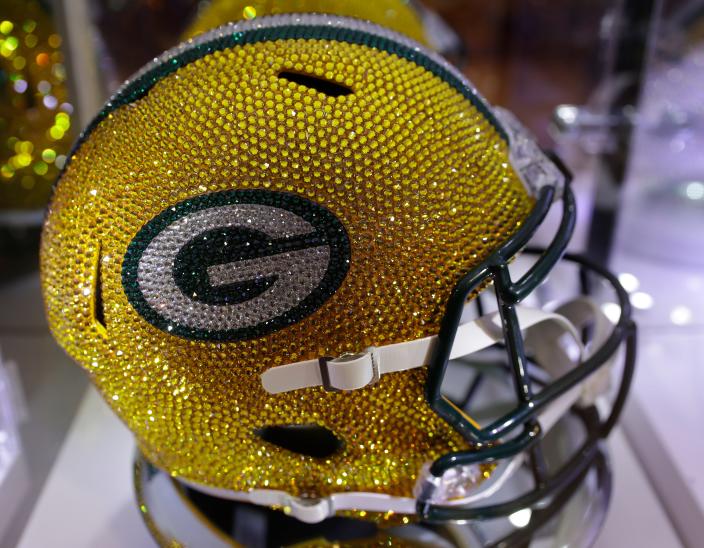 A $10,000 Swarovski crystal-covered Green Bay Packers helmet for sale at the Packers Pro Shop on Jan. 17, 2023, in Green Bay, Wis.