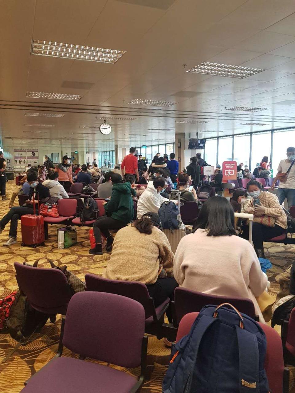 Upon arrival from Wuhan, 174 Singaporeans and their family members awaiting processing and quarantine at Changi Airport on the morning of Sunday, 9 February 2020. PHOTO: Qu Haiyan