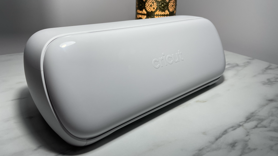 Cricut Joy Xtra; a white craft machine on a marble worktop