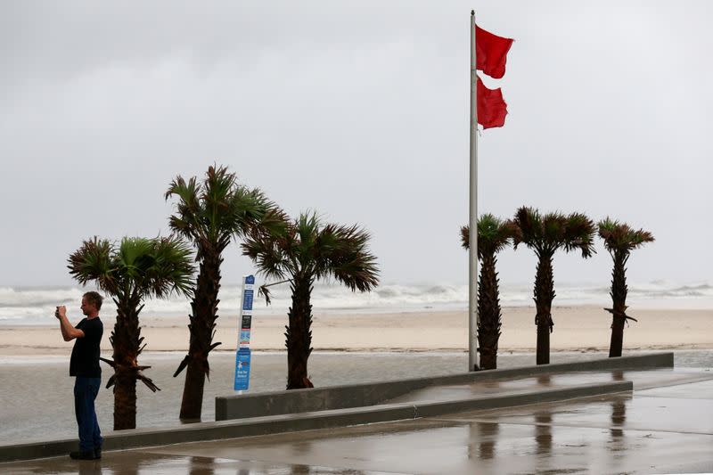 Resident John Michael takes pictures as Hurricane Sally approaches in Gulf Shores