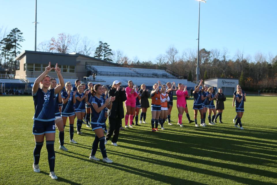 Washburn women's soccer celebrates after defeating Adelphi 1-0 in the national semifinal on Thursday, Dec. 7.