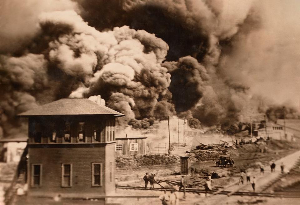 Buildings burning during Race Riots, Greenwood District, Tulsa, Oklahoma, USA, Unidentified Artist, June 1921. (Photo by: Circa Images/GHI/Universal History Archive/Universal Images Group via Getty Images)