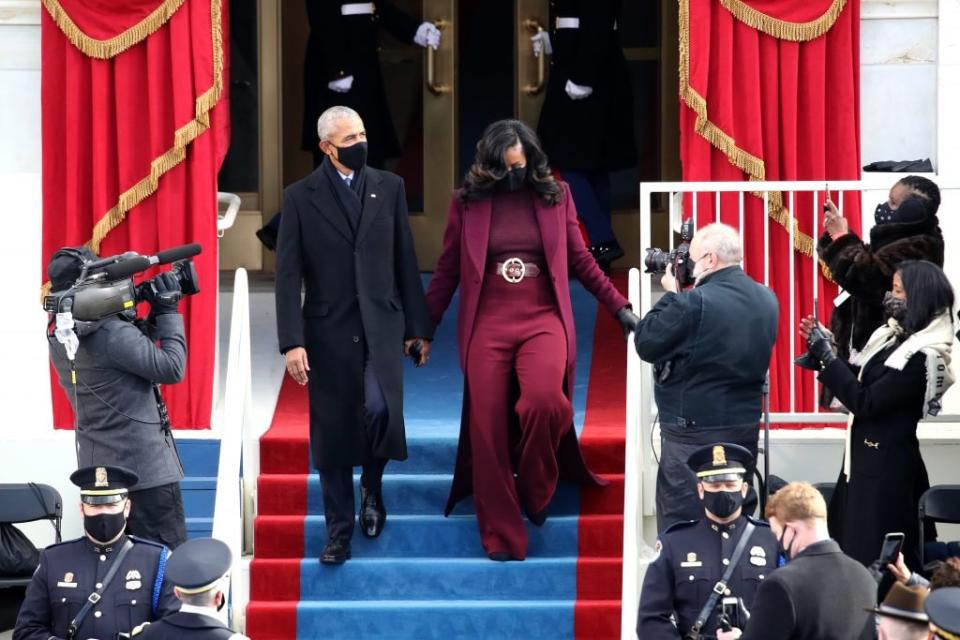 Former U.S. President Barack Obama and former first lady Michelle Obama arrive at the inauguration of U.S. President-elect Joe Biden on the West Front of the U.S. Capitol on January 20, 2021 in Washington, DC. (Photo by Rob Carr/Getty Images)