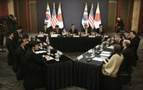 South Korea's delegation, center, led by Special Representative for Korean Peninsula Peace and Security Affairs Hwang Joon-kook (C top), U.S. delegation (R), and Japan's delegation (L), attend at their meeting to discuss a variety of bilateral and multilateral responses to the North Korea’s nuclear test in Seoul, South Korea January 13, 2016. REUTERS/Ahn Young-joon/Pool