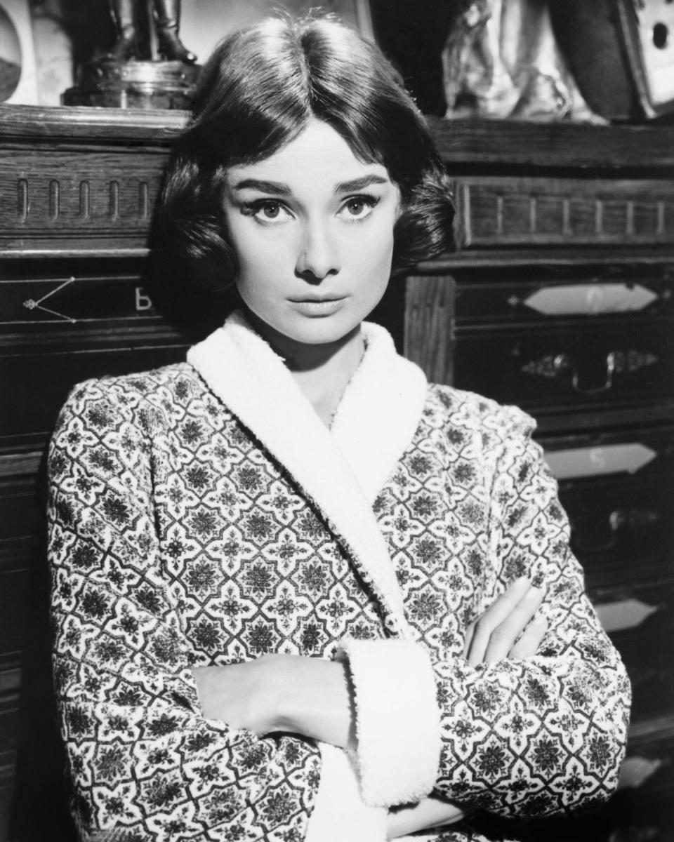 Hepburn photographed in 1955 wearing a patterned robe.&nbsp;