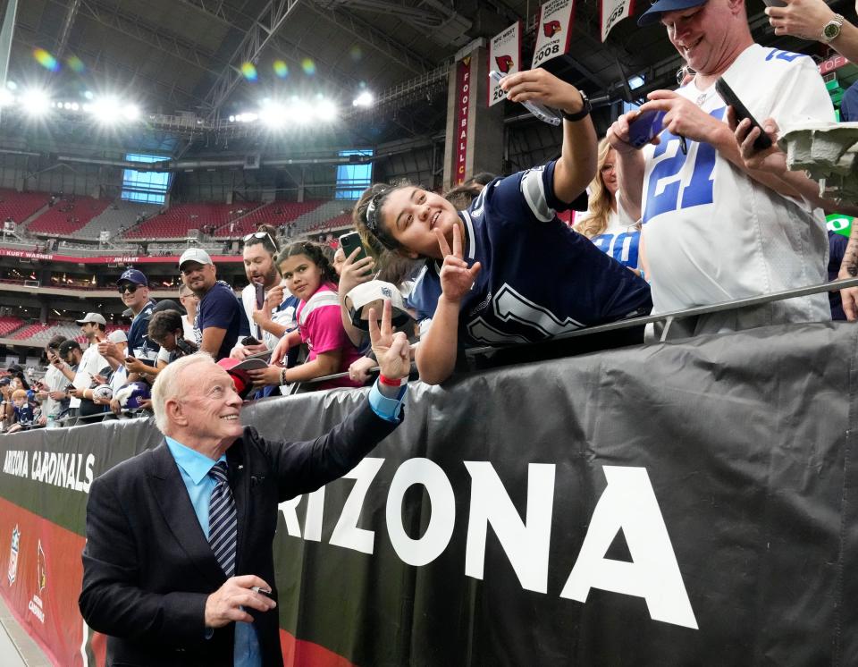 Sep 24, 2023; Glendale, Arizona, USA; Dallas Cowboys owner Jerry Jones poses for a photograph with a Cowboys fans before the game against the Arizona Cardinals at State Farm Stadium. Mandatory Credit: Rob Schumacher-Arizona Republic