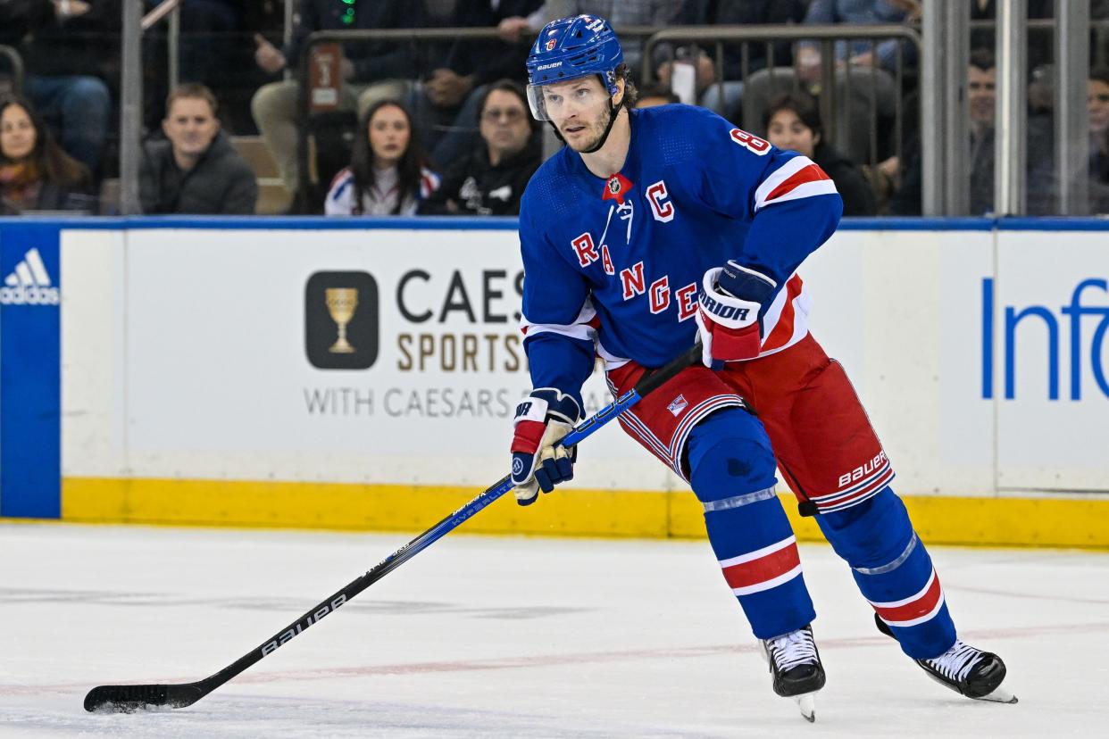 Apr 23, 2024; New York, New York, USA; New York Rangers defenseman Jacob Trouba (8) skates with the puck against the Washington Capitals during the first period in game two of the first round of the 2024 Stanley Cup Playoffs at Madison Square Garden.