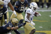 Tulsa running back Corey Taylor II (24) runs with the ball past Navy linebacker Diego Fagot (54) during the first half of an NCAA college football game, Saturday, Dec. 5, 2020, in Annapolis, Md. (AP Photo/Nick Wass)