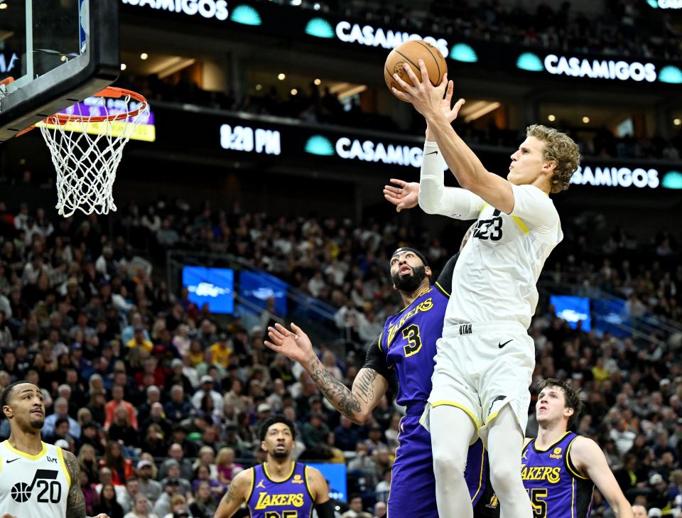 Utah Jazz forward <a class="link " href="https://sports.yahoo.com/nba/players/5769" data-i13n="sec:content-canvas;subsec:anchor_text;elm:context_link" data-ylk="slk:Lauri Markkanen;sec:content-canvas;subsec:anchor_text;elm:context_link;itc:0">Lauri Markkanen</a> (23) puts in a layup with Los Angeles Lakers forward <a class="link " href="https://sports.yahoo.com/nba/players/5007" data-i13n="sec:content-canvas;subsec:anchor_text;elm:context_link" data-ylk="slk:Anthony Davis;sec:content-canvas;subsec:anchor_text;elm:context_link;itc:0">Anthony Davis</a> (3) defending as Utah and Los Angeles play at the Delta Center in Salt Lake City on Saturday, Jan. 13, 2024. | Scott G Winterton, Deseret News