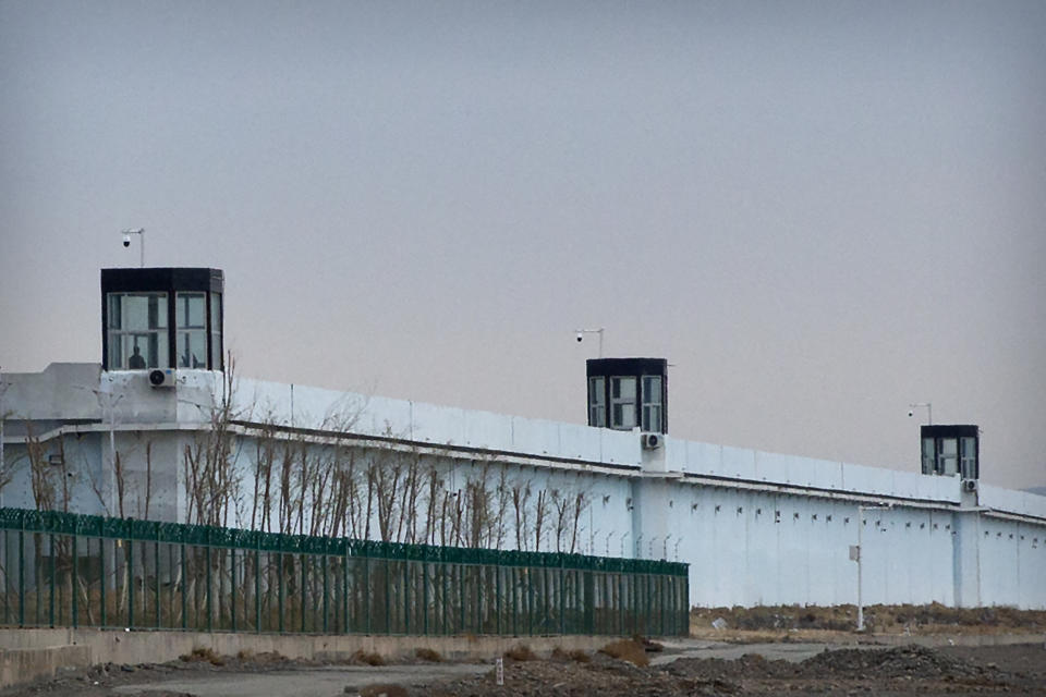 A person stands in a tower on the perimeter of the Number 3 Detention Center in Dabancheng in western China's Xinjiang Uyghur Autonomous Region on April 23, 2021. Human rights groups and Western nations led by the United States, Britain and Germany accused China of massive crimes against the Uyghur minority and demanded unimpeded access for U.N. experts at a virtual meeting on Wednesday, May 12, 2021 denounced by China as "politically motivated" and based on "lies." (AP Photo/Mark Schiefelbein)