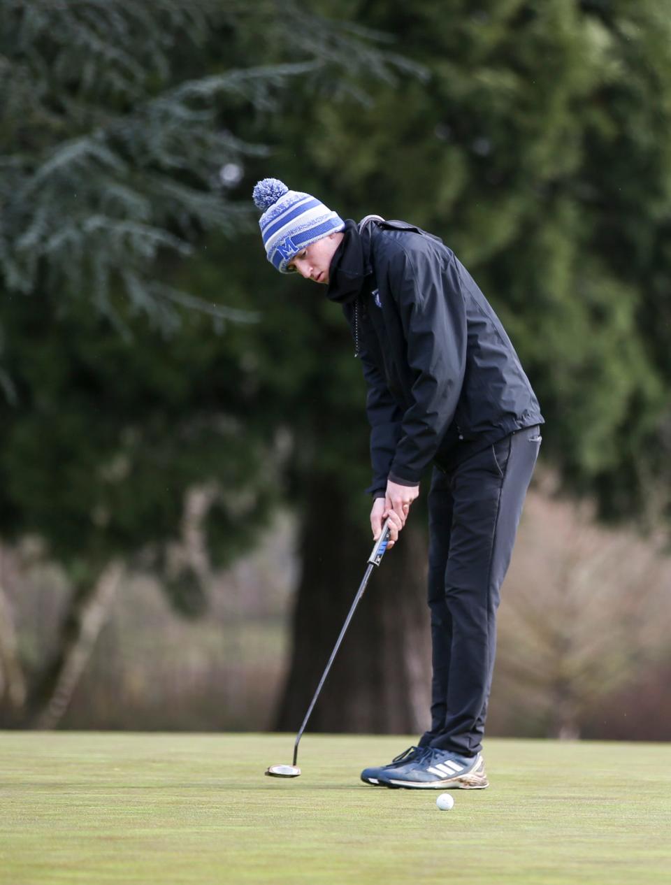 McNary’s Colby Sullivan putsts during the CVC match on Monday, April 3, 2023 at Illahe Hills Country Club in Salem, Ore.