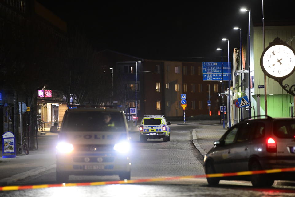 Police are seen in the area after several people were attacked in Vetlanda, Sweden, Wednesday, March 3, 2021. Swedish police say a man has assaulted at least eight people in a southern Sweden town, and that the case was being investigated as ”a suspected terrorist crime.” Police said a man in his 20s attacked people in the small town of Vetlanda, about 190 kilometers (118 miles) southeast of Goteborg, Sweden’s second largest city. (Mikael Fritzon/TT News Agency via AP)