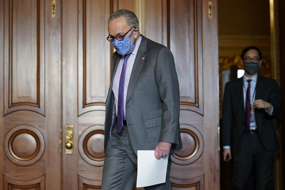 Senate Minority Leader Sen. Chuck Schumer of N.Y., arrives to speak to reporters on Capitol Hill in Washington, Wednesday, Dec. 30, 2020, before his meeting with Transportation Secretary-designate Pete Buttigieg. (AP Photo/Susan Walsh)