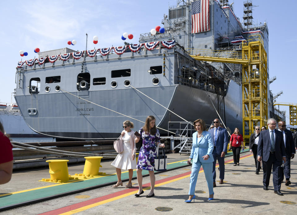 Speaker of the House Nancy Pelosi walks past the USNS John Lewis after a christening ceremony Saturday July 17, 2021, in San Diego. (AP Photo/Denis Poroy)