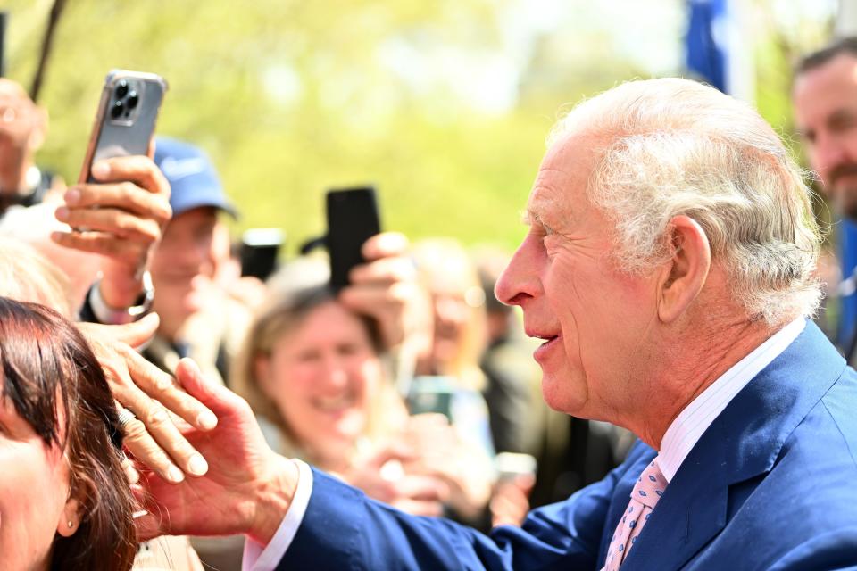 King Charles III greets members of the public along the Mall as preparations continue ahead of the Coronation of King Charles III and Queen Camilla on May 05, 2023 in London, England.